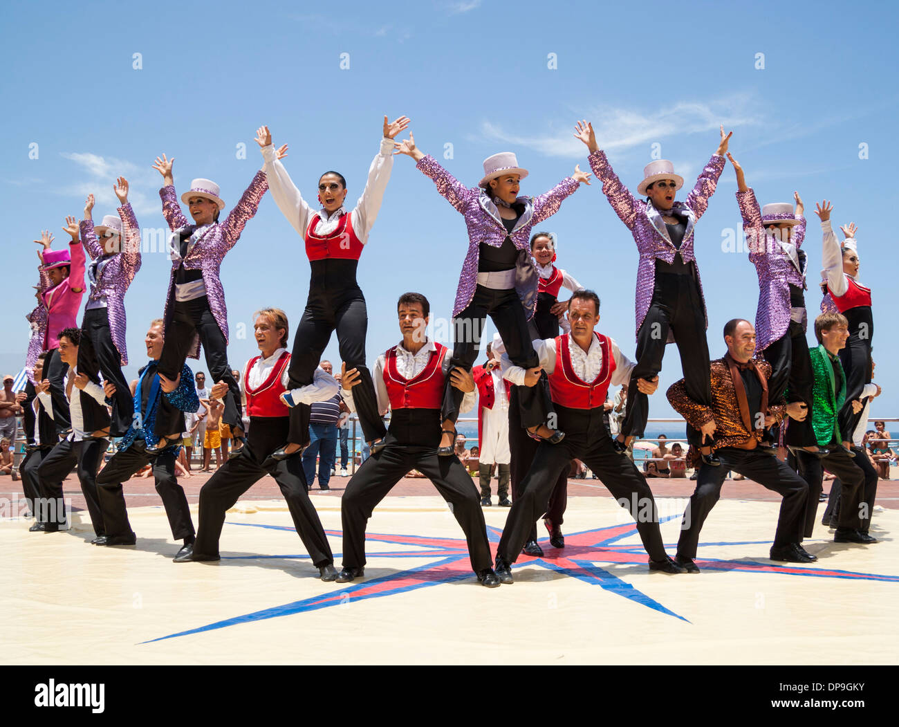 Circus performers performing free in street in Spain to promote Circus`s visit to town Stock Photo